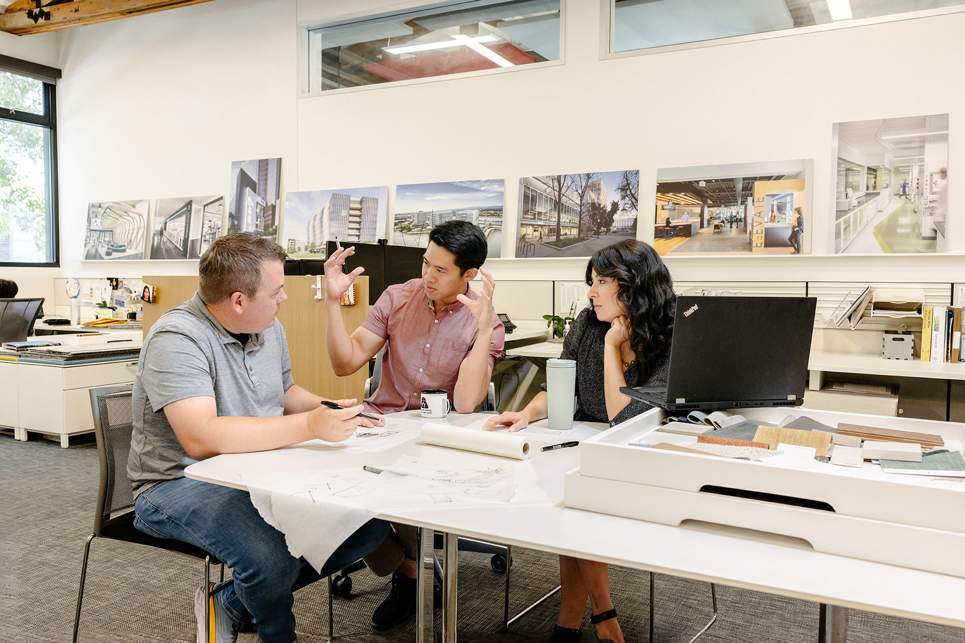 Interior at DGA Sacramento Office, three people talking