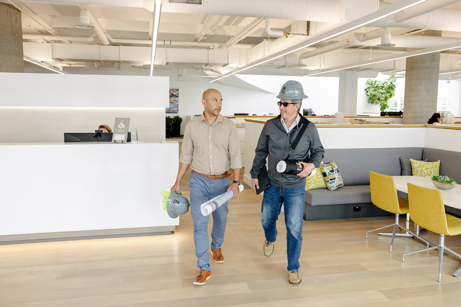 Interior at DGA San Diego Office, two people walking