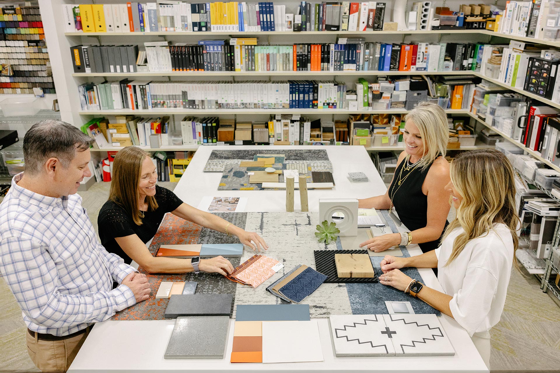 Interior at DGA San Diego Office, four people talking