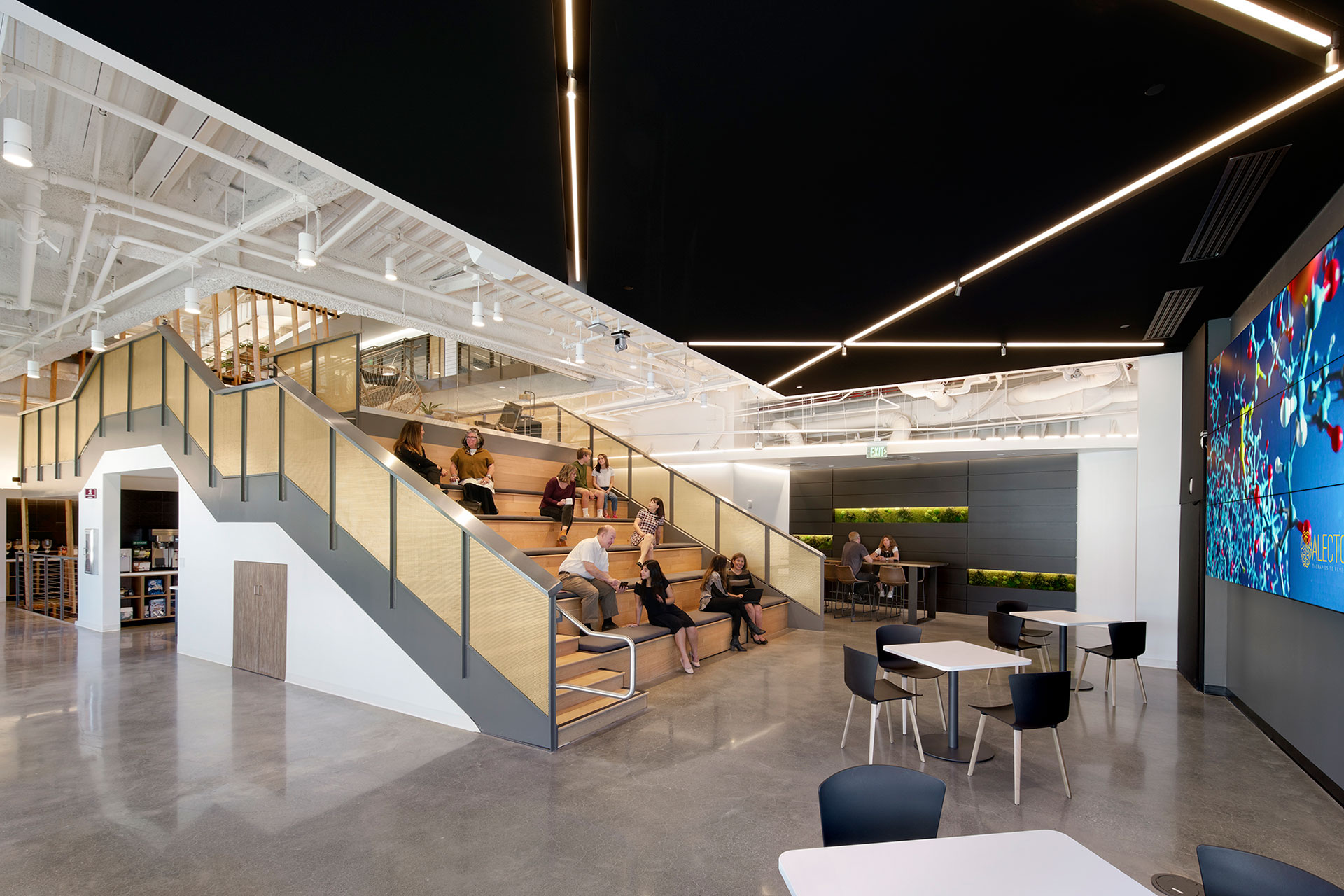 Interior at Alector life Science facility large group seating area, presentation area, gathering space, biophilia