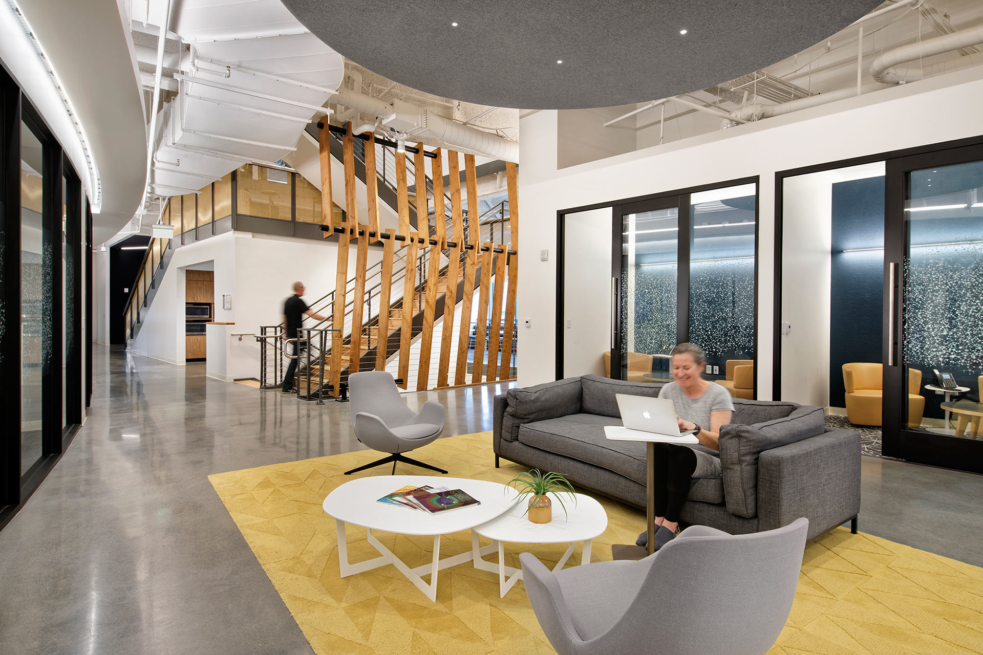 Interior at Alector life Science facility collaboration space, offices, circulation, central stair