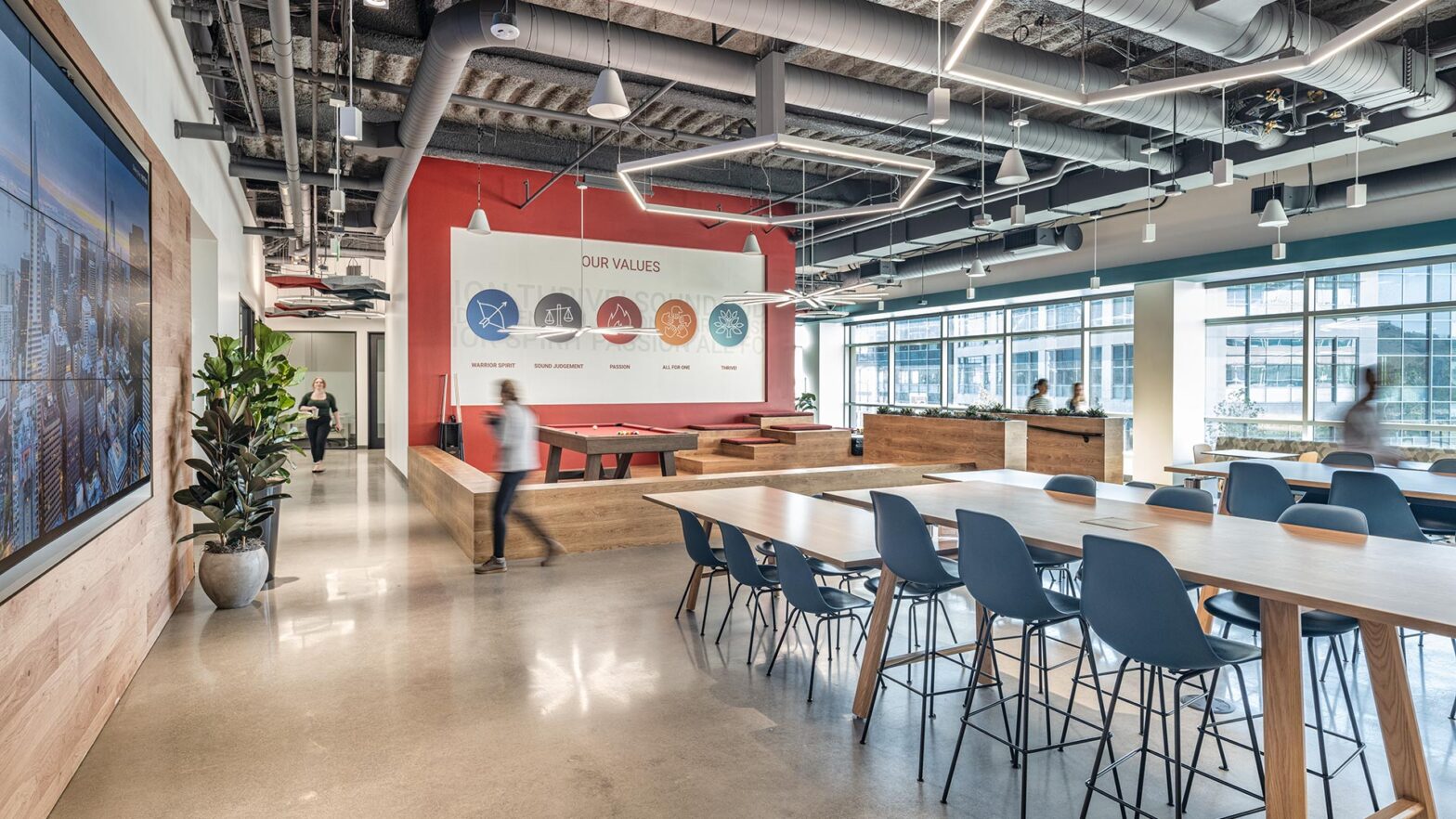 Interior at confidential client life science facility break room, games, branding