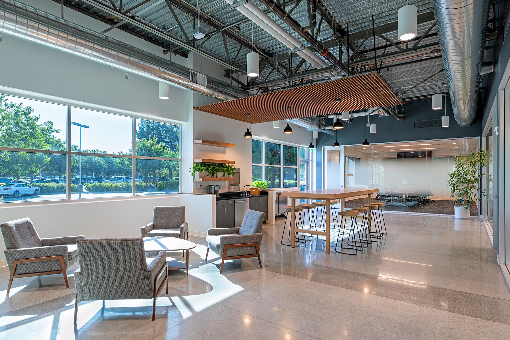 Interior at confidential client advanced technology facility break room and kitchen with view to conference room