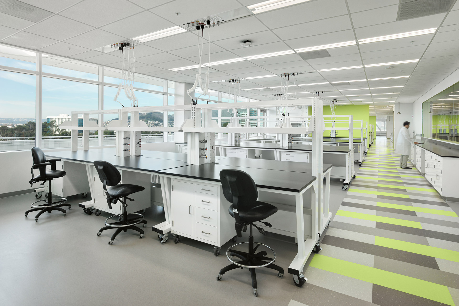 Interior at a confidential life science facility, lab with person in lab coat working