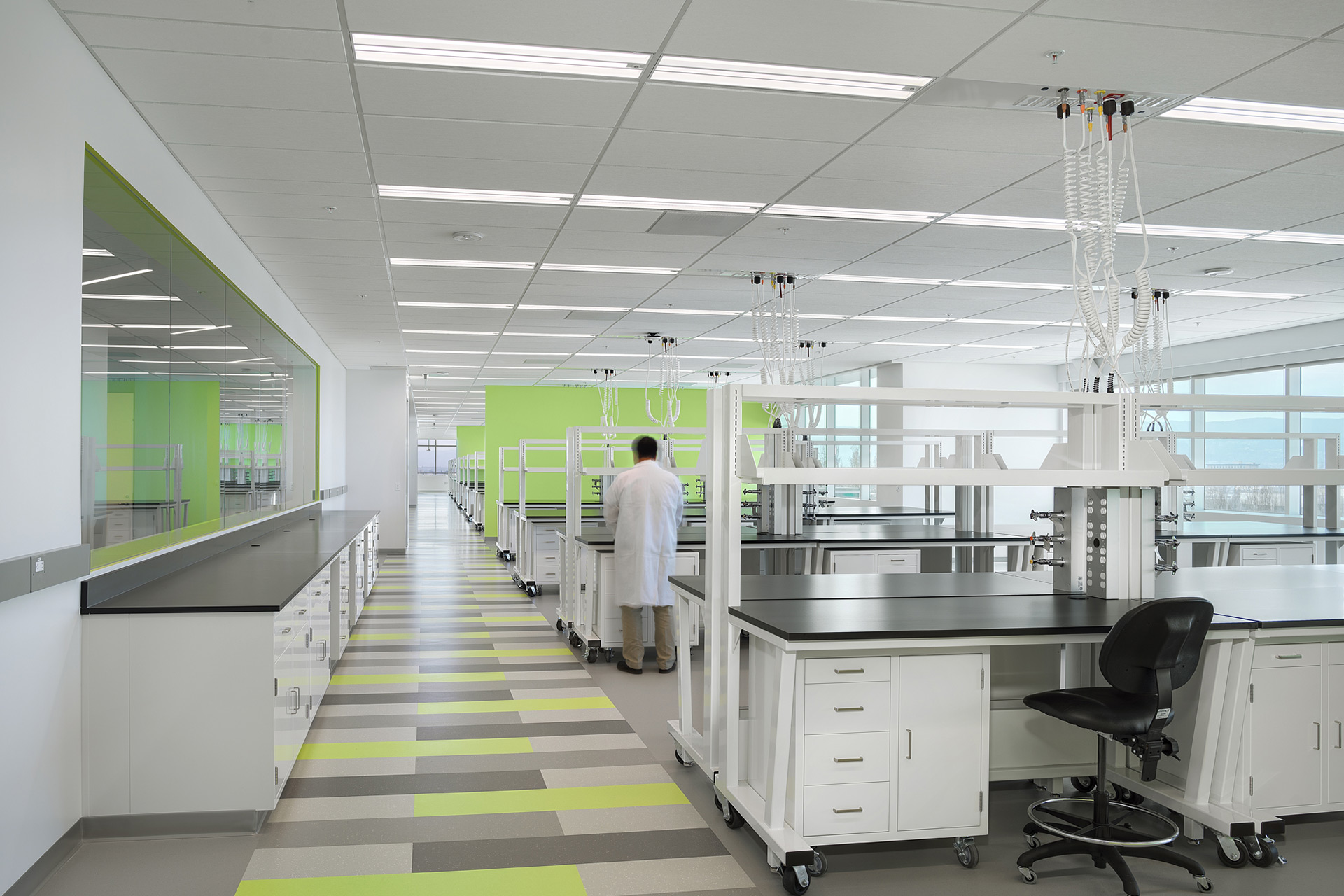 Interior at a confidential life science facility, lab with person in lab coat working