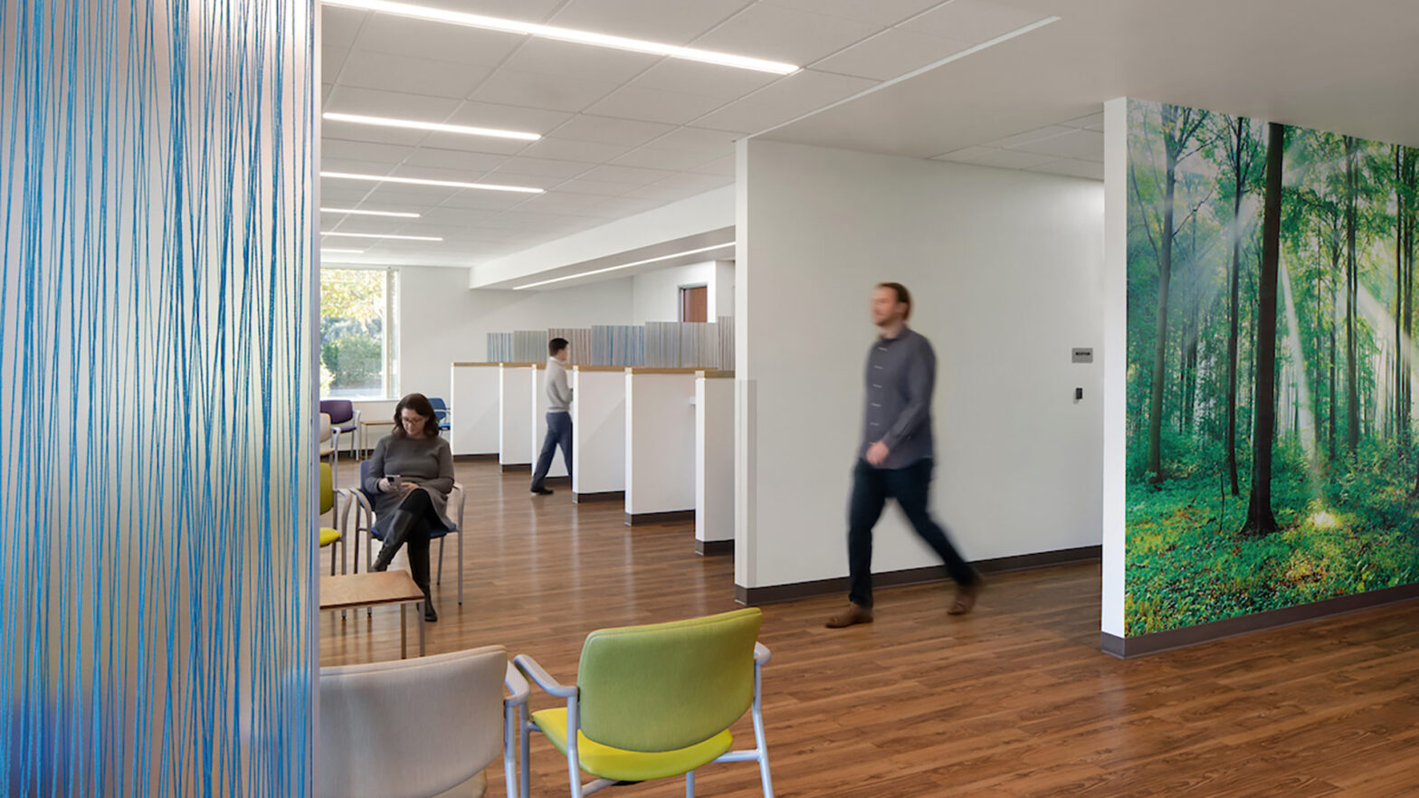 Interior of Elica Health Watt healthcare facility lobby area with people in the space