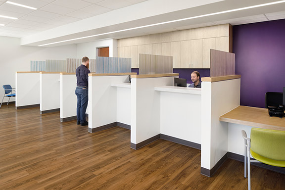 Interior of Elica Health Watt healthcare facility lobby area with people in the space