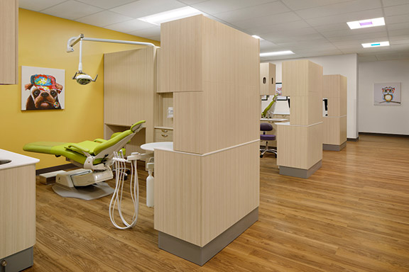 Interior of Elica Health Watt healthcare facility multiple exam chairs and cabinets