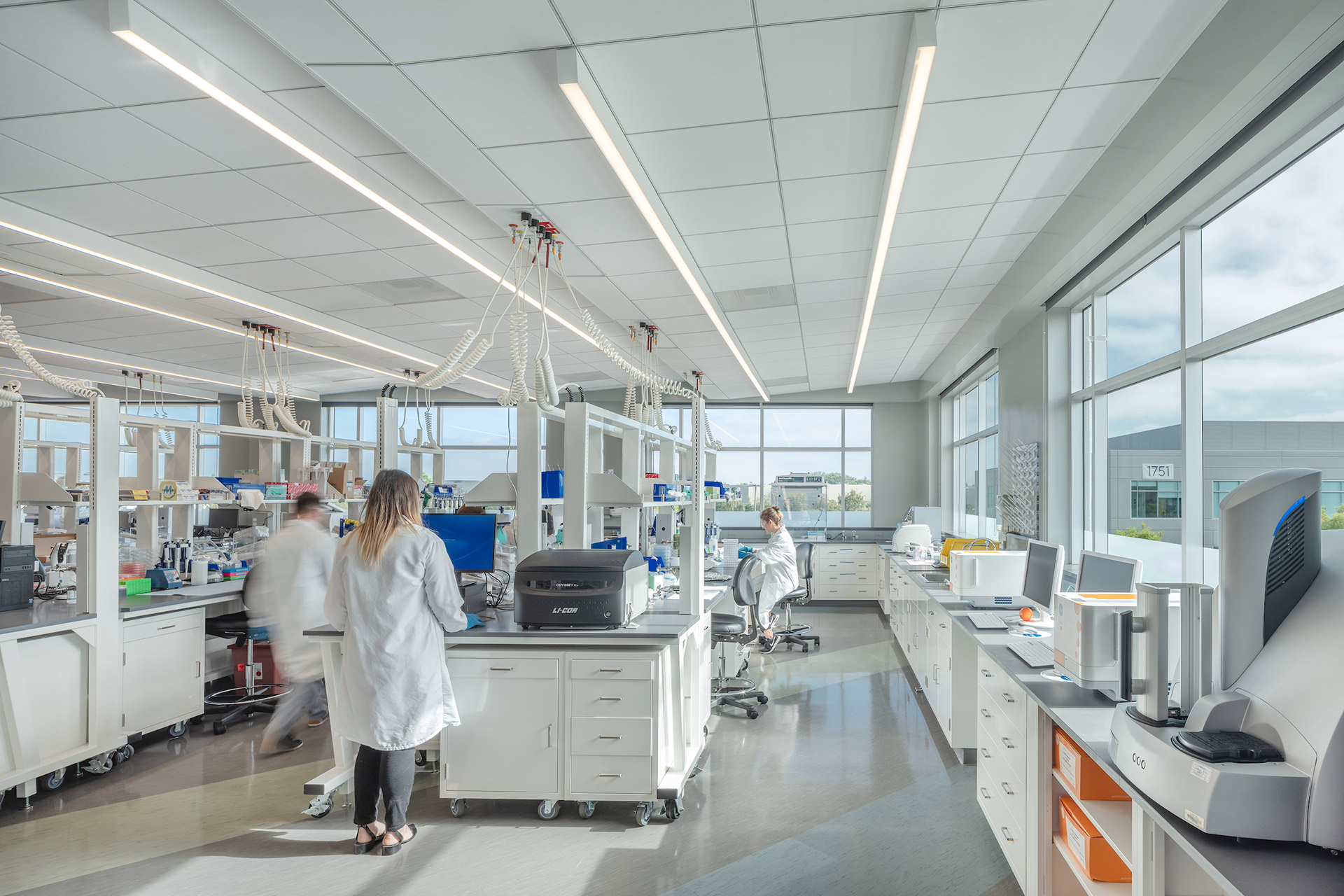 Interior at Exelixis 1851 and 1801 HBP life science facility inside lab with people working