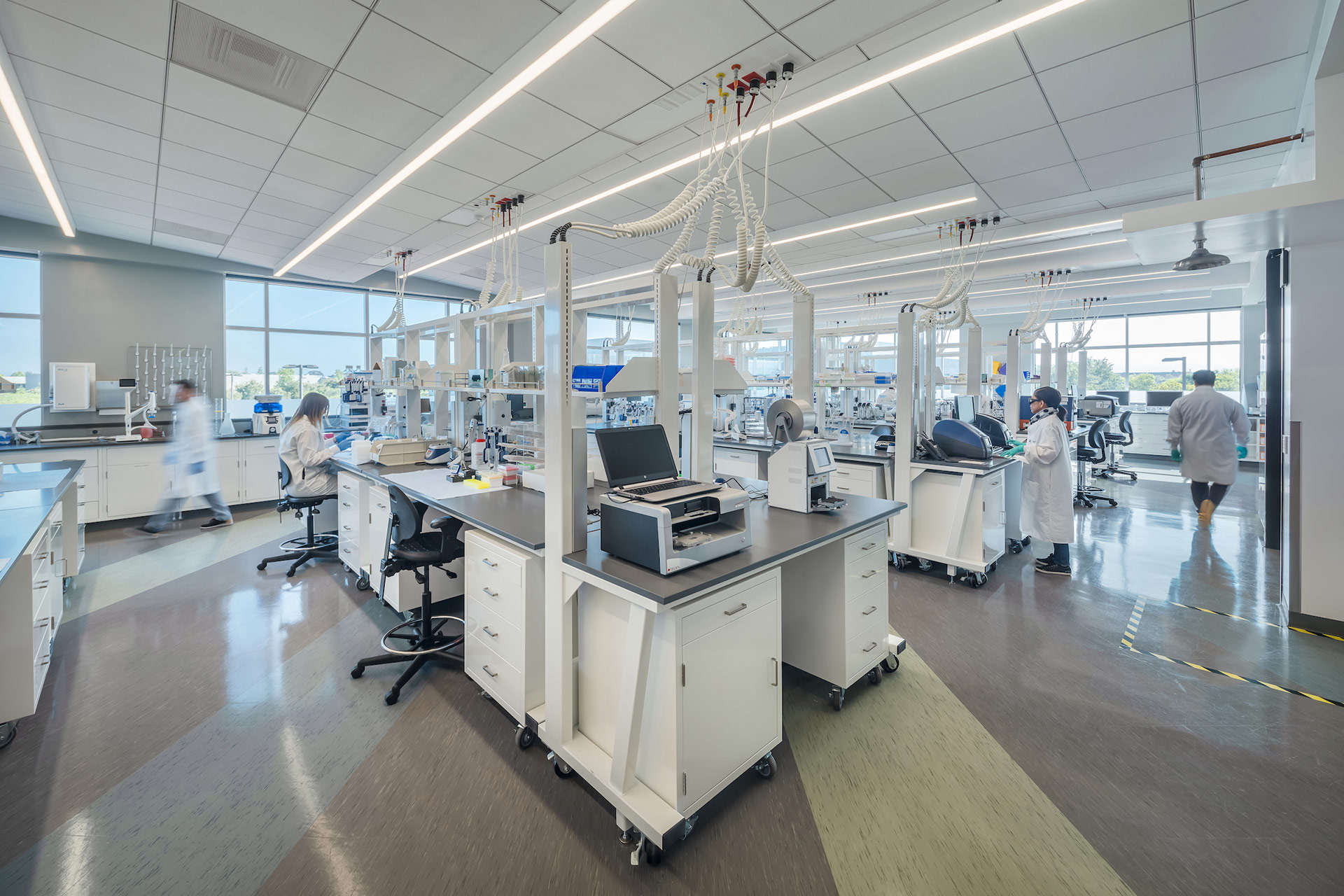 Interior at Exelixis 1851 and 1801 HBP life science facility inside lab with people working