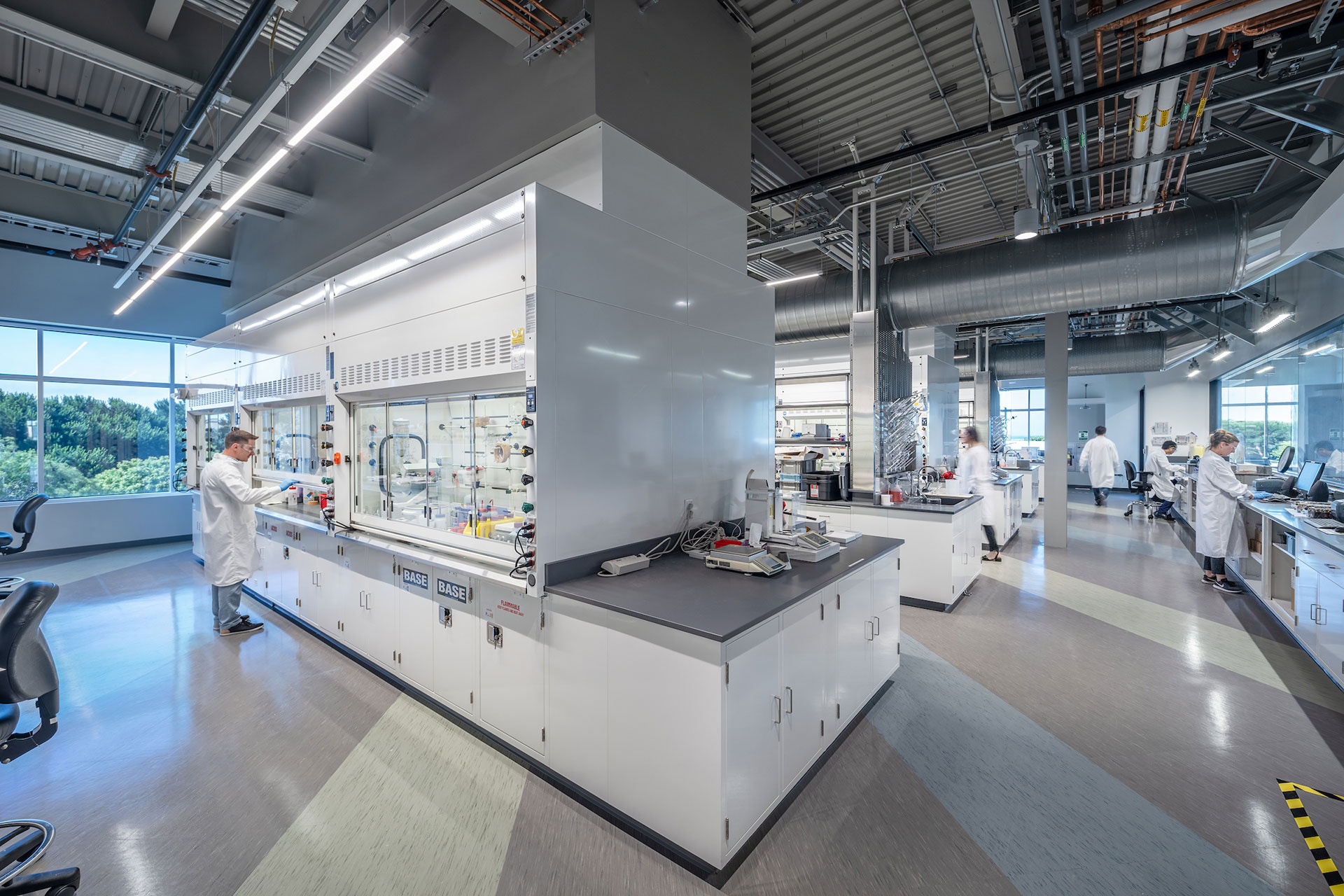 Interior at Exelixis 1851 and 1801 HBP life science facility inside lab with people working