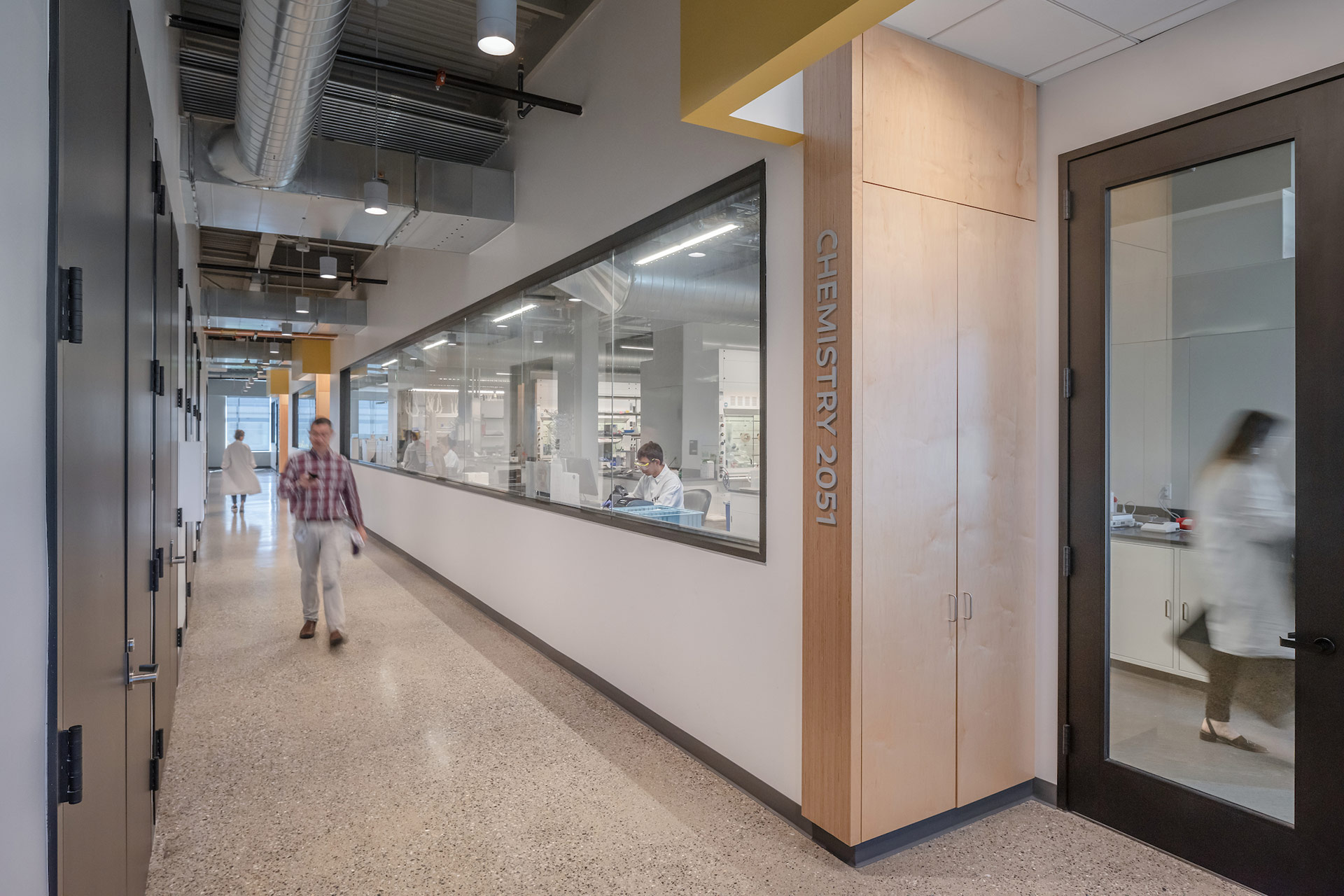 Interior at Exelixis 1851 and 1801 HBP life science facility circulation outside labs with people walking through