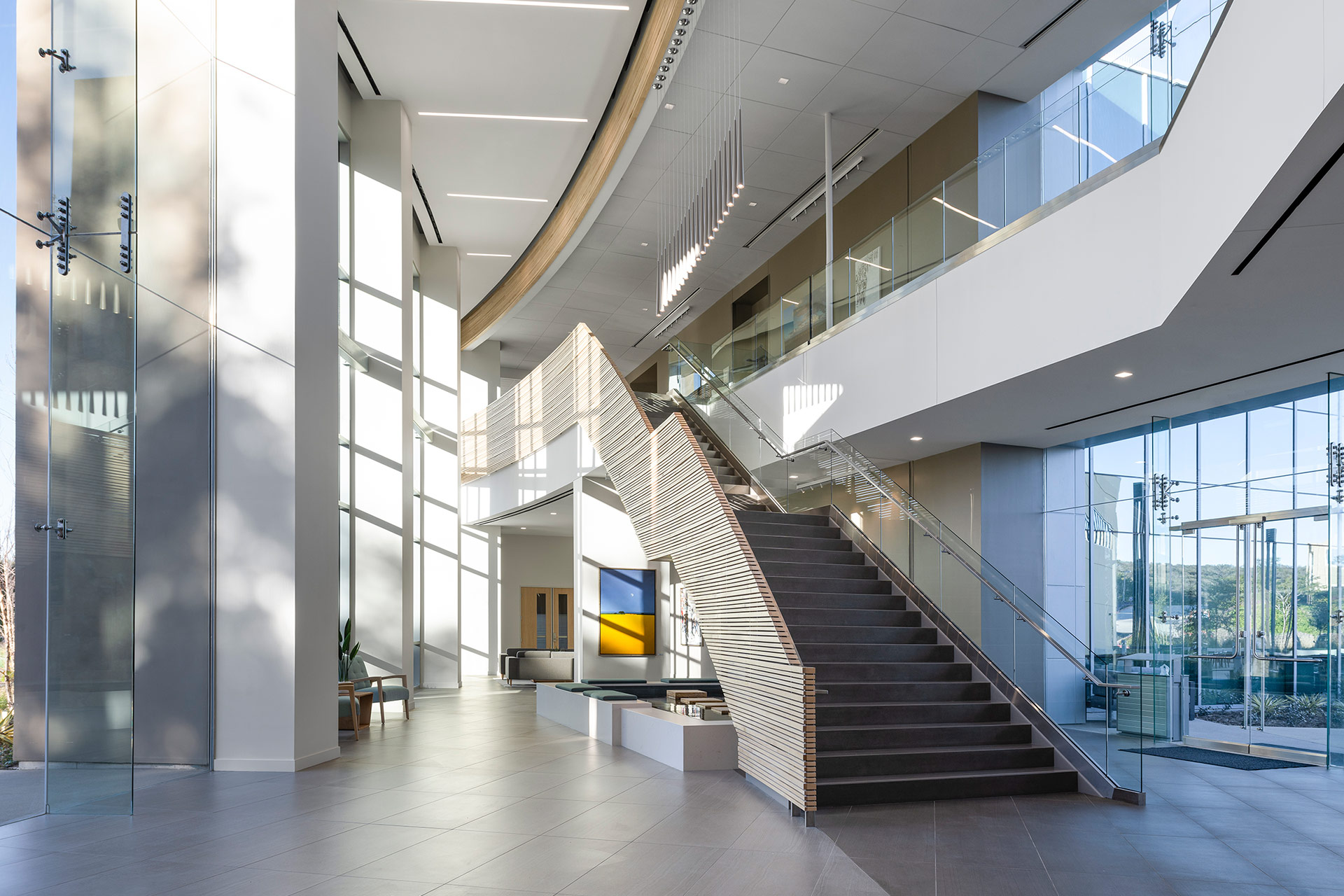 Interior at Ionis Conference Center lobby with view of staircase and water feature
