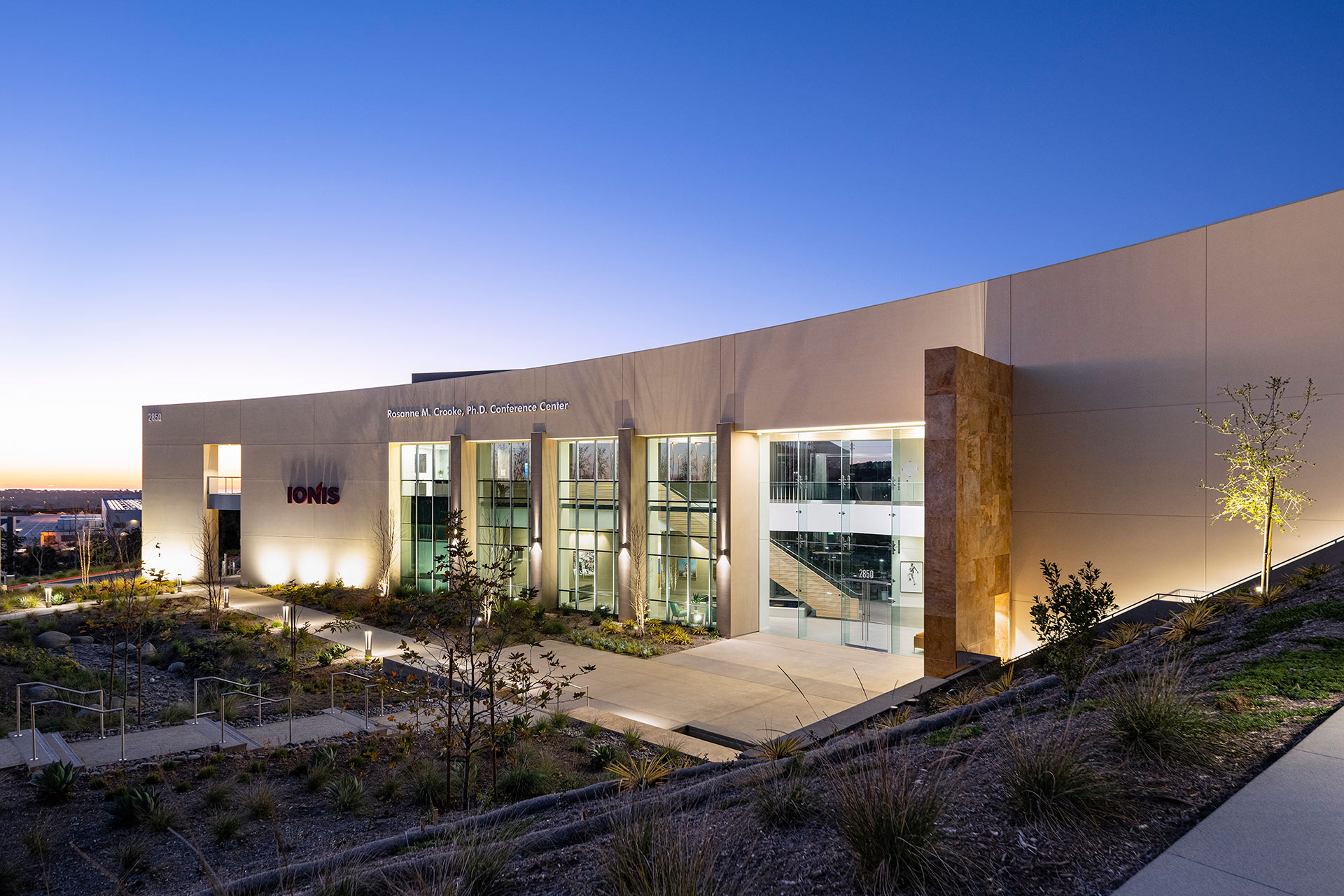 Exterior at Ionis Conference Center evening view of front of the facility