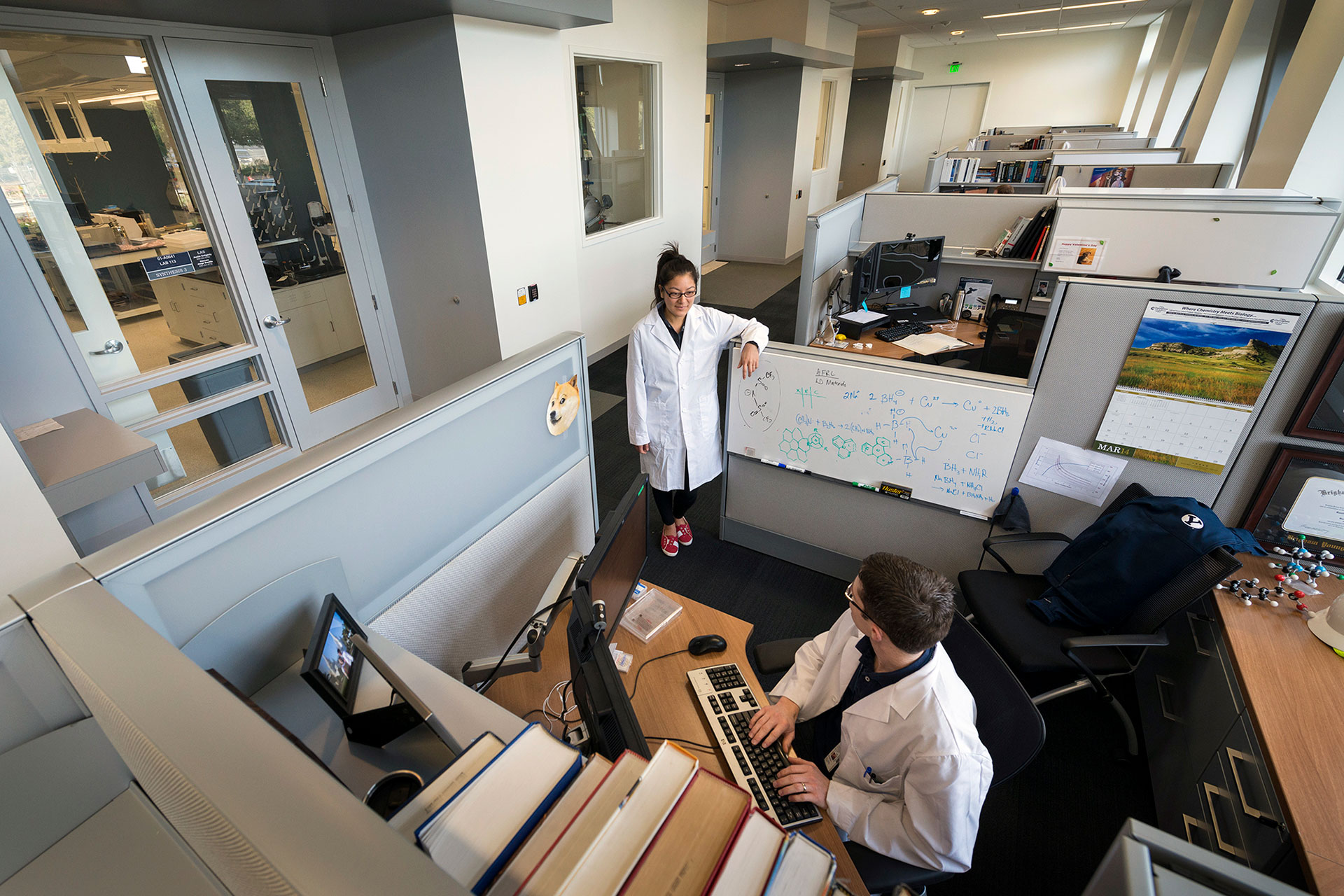 Interior at Lockheed Martin B245 advanced technology facility, open office with view into labs