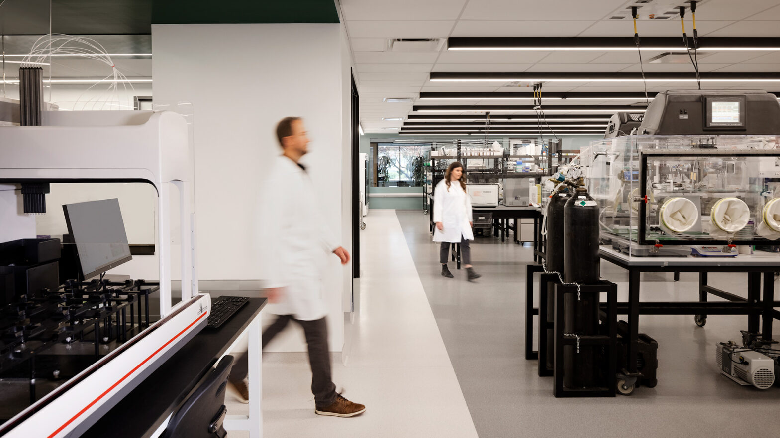 Interior at Pivot Bio life science facility, lab with people working