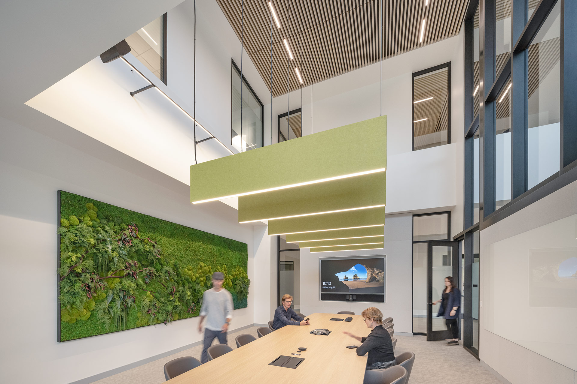 Interior at Takara Bio life science facility, large double height conference room with large biophilia green wall feature