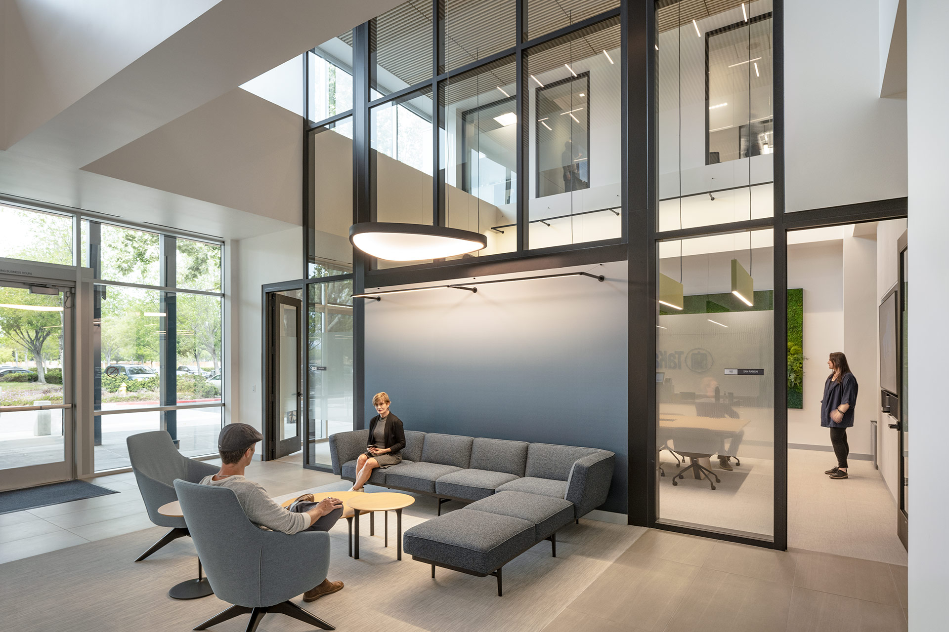 Interior at Takara Bio life science facility, lobby lounge space with view into large double height conference room