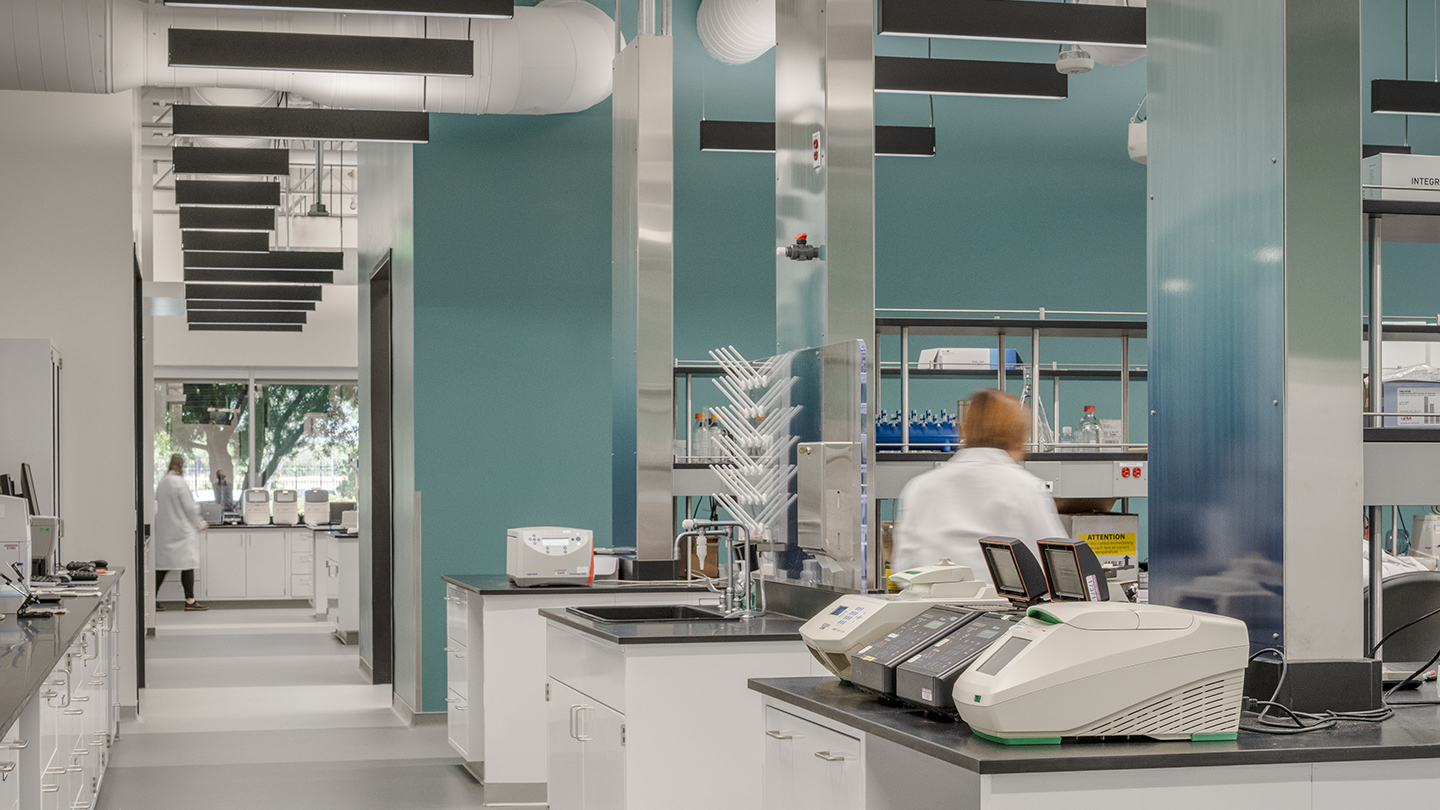 Interior at Takara Bio life science facility, lab with people working within