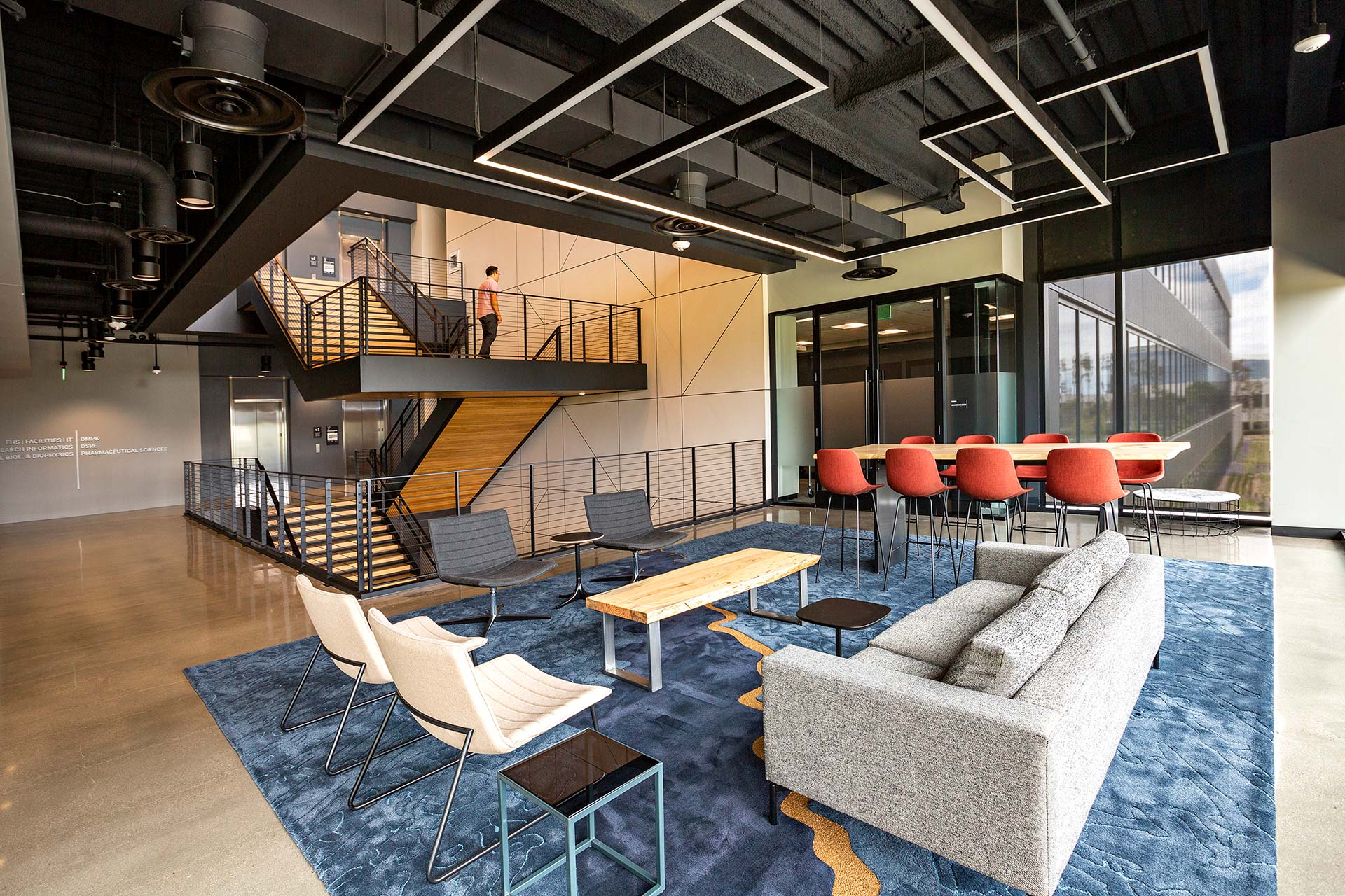 Interior at Takeda Research lobby, central stair, branding