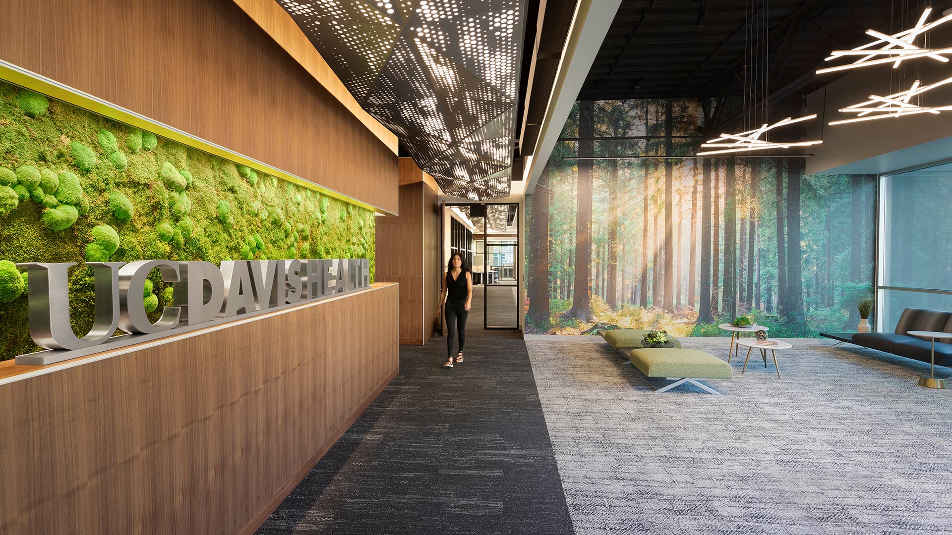 Interior at UC Davis Health patient contact center, healthcare, person walking through lobby lounge area