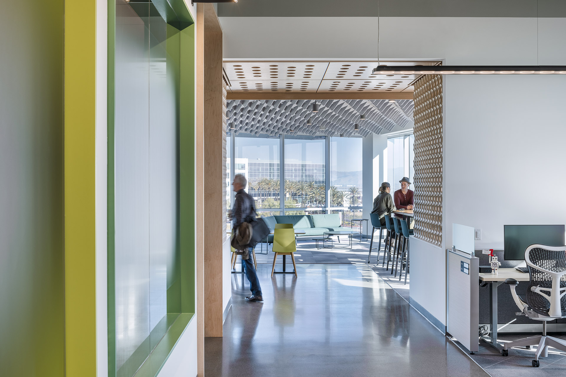 Interior at Verb Surgical HQ life science facility, circulation with views into open office and breakroom spaces